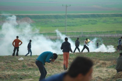 Israeli forces fire tear gas at Palestinian demonstrators during the Jabaliya protest on 21 February. (Photo by Charlie Andreasson)