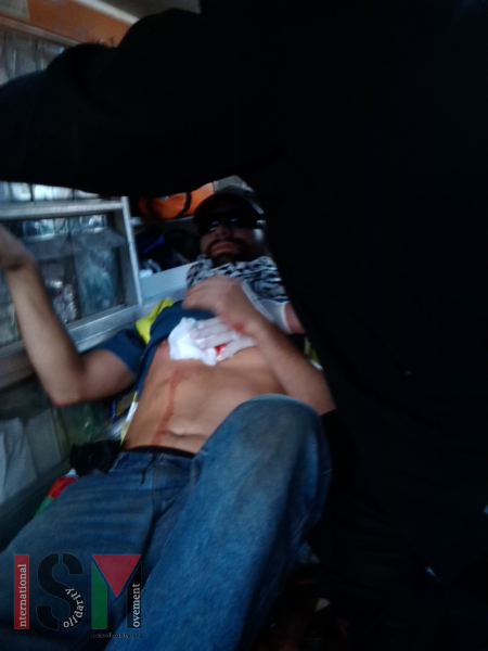 Olmo receiving treatment from paramedics in the ambulance on the way to hospital.