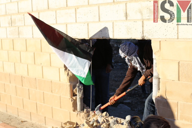 Palestinian activists destroy section of Apartheid wall