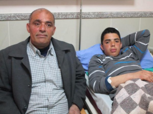 Abbas Jamal, 18, with his father Jamal Asous (photo by ISM).