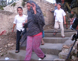 Palestinian woman and her children attacked by settlers