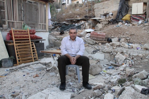 Nureddin Amro sitting on the rubble of his home, which was demolished on March 31st this year (photo credit The Washington Post)