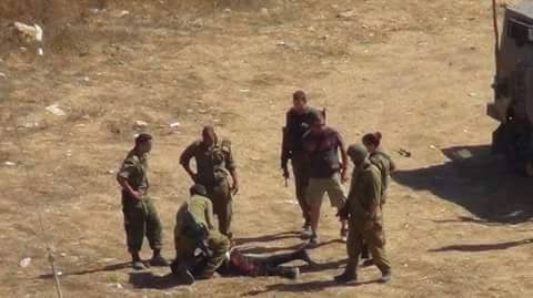 Israeli soldiers arresting Mahmoud in Nabi Saleh