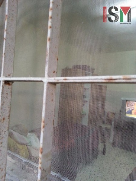 Amira sits immobile in her bedroom which frequently has teargas shot by Israeli forces seeping inside the windows 