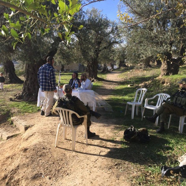 Illegal settlers close to the Soumud house