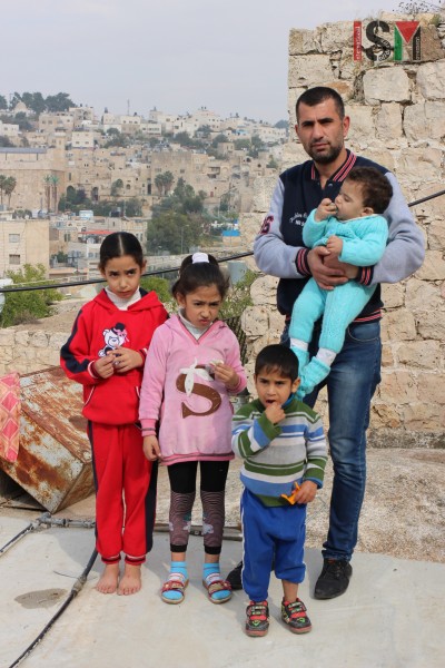 Palestinian family on their roof
