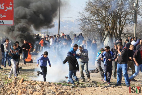 Demonstration attacked with tear gas shot by Israeli forces.