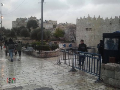 Israeli police stand on both sides of the Damascus Gate exit, in the Palestinian neighborhood.