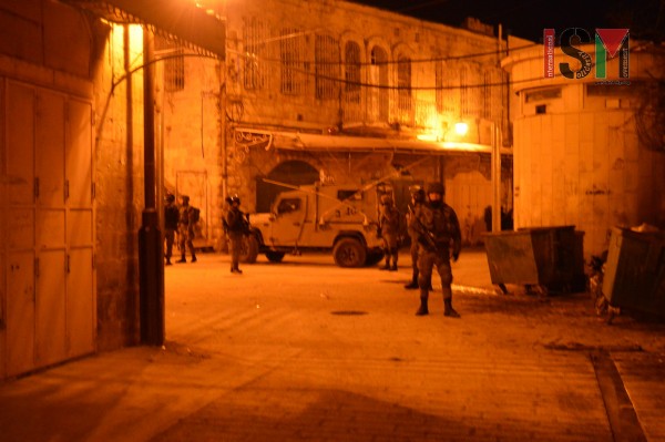 Israeli forces blocking the entrance to the Palestinian market