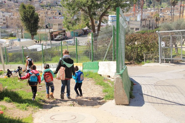 International volunteers ensuring the kindergarten kids get home safe
