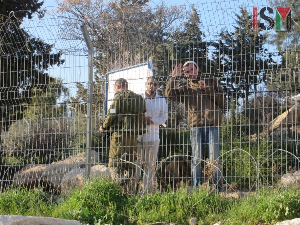 Illegal settlers and Israeli soldier