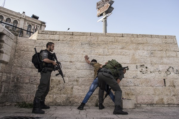 Young men are constantly being stopped, interrogated and searched by occupying forces in front of Damascus Gate and in the old city. In the top left corner you can see a snipers post on a building overlooking Damascus Gate. This post was placed without permission from the Palestinian owners.