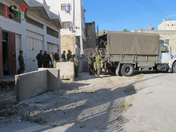 Israeli forces moving into the building next to the girls school