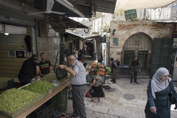 People going about their everyday business must negotiate the military and police presence that is everywhere in the old city.