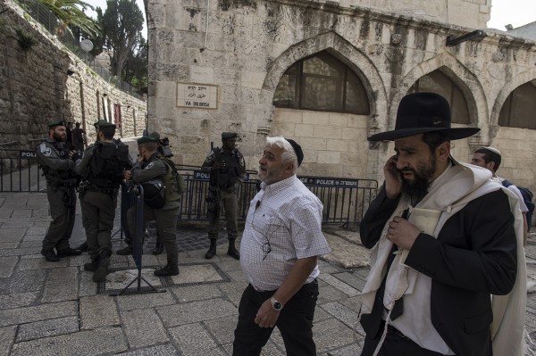 Jewish Israelis and tourists wait at the Morrocan Gate to go up to Al Haram al Sharif