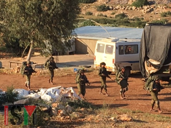 Soldiers training on Palestinian land.