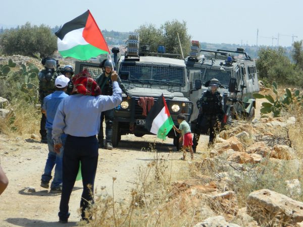 The Israeli Border Police threatened peaceful demonstrators, and did not allow the march to the wall to continue