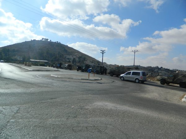Israeli Army jeeps block off entrance to Al Fawwar refugee camp.