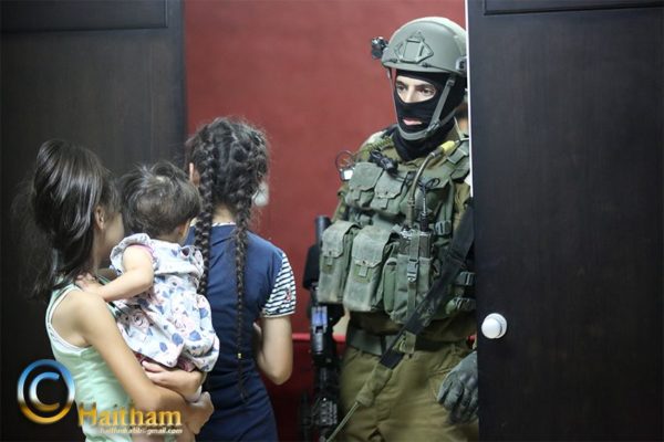 Israeli forces in Palestinian family home Photo credit: Haitham al-Khatib