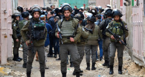 Israeli Forces escorting israeli settlers through palestinian neighbourhood