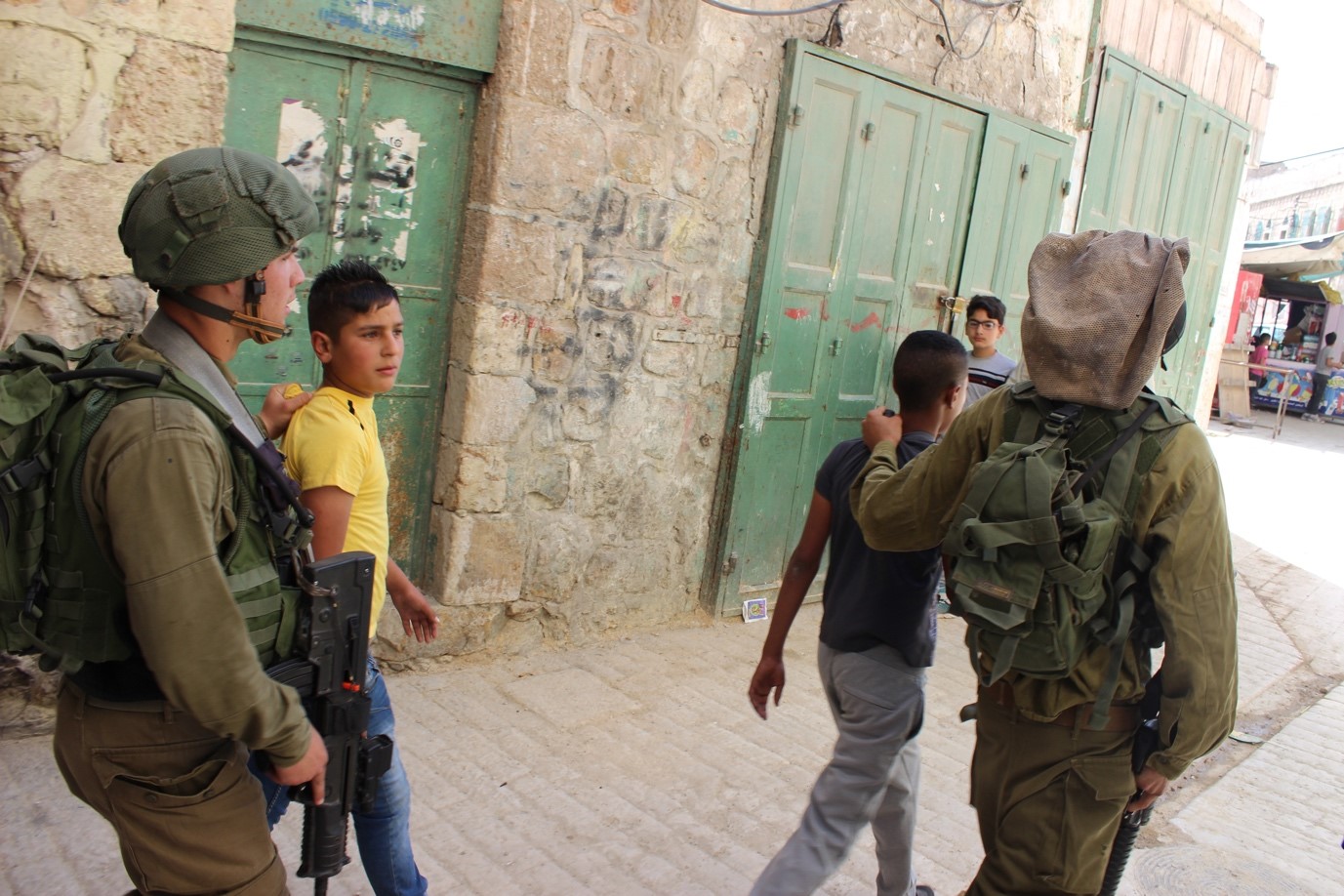 Teenager beaten and dragged off the street by soldiers in Hebron