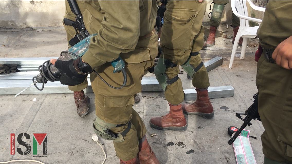 Israeli soldiers order Palestinian family to halt approved rooftop construction