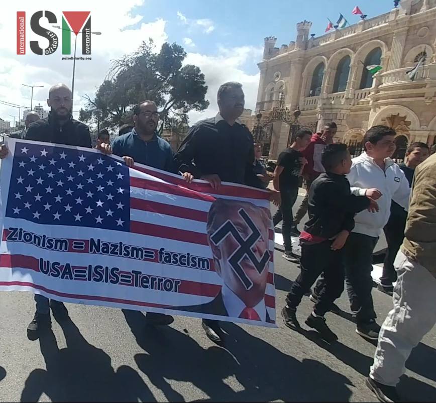 Palestinians pray in the streets of Bethlehem and march against Donald Trump