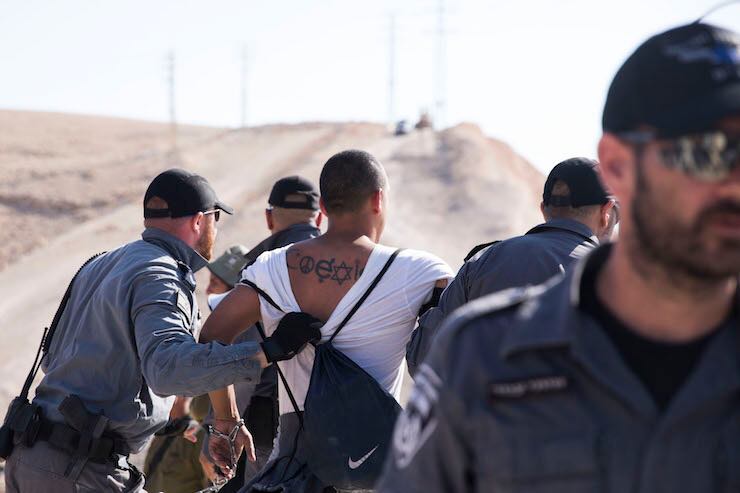 Experiencing arrest in Khan al-Ahmar, threatened by demolition by Israeli forces