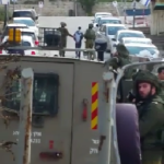 Soldiers arresting 14-year old Ahmer Eqneibi