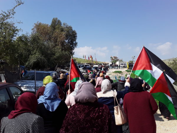Women marching toward Khan al-Ahmar