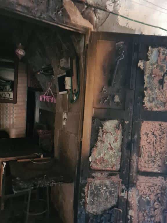 Fire marks on a building in Al-Khalil (Hebron)