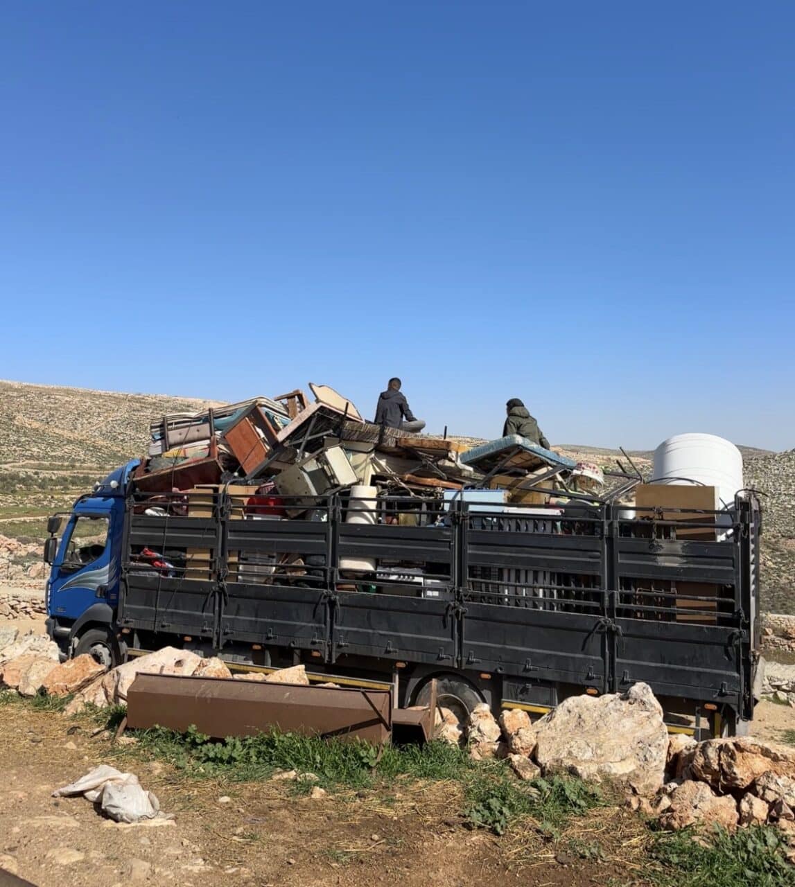 Photo: the final two families leave Al Khalayel valley with their belongings, following a series of brutal attacks by Israel