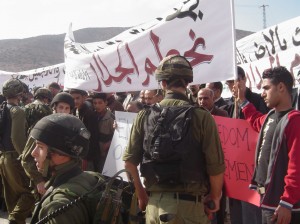 IOF soldiers stop the demonstrators reaching the checkpoint